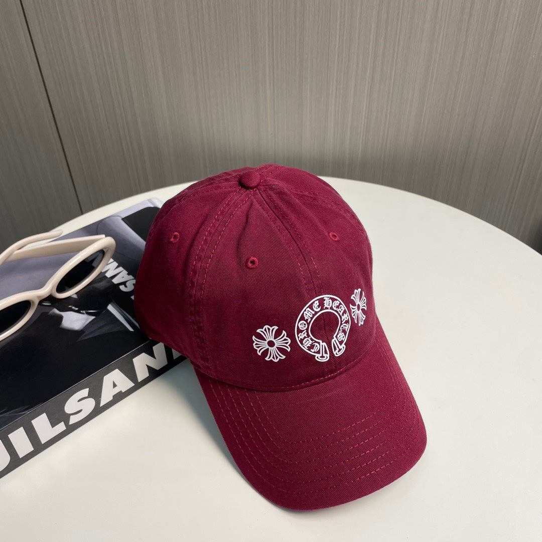 A burgundy baseball cap from Chrome Hearts.