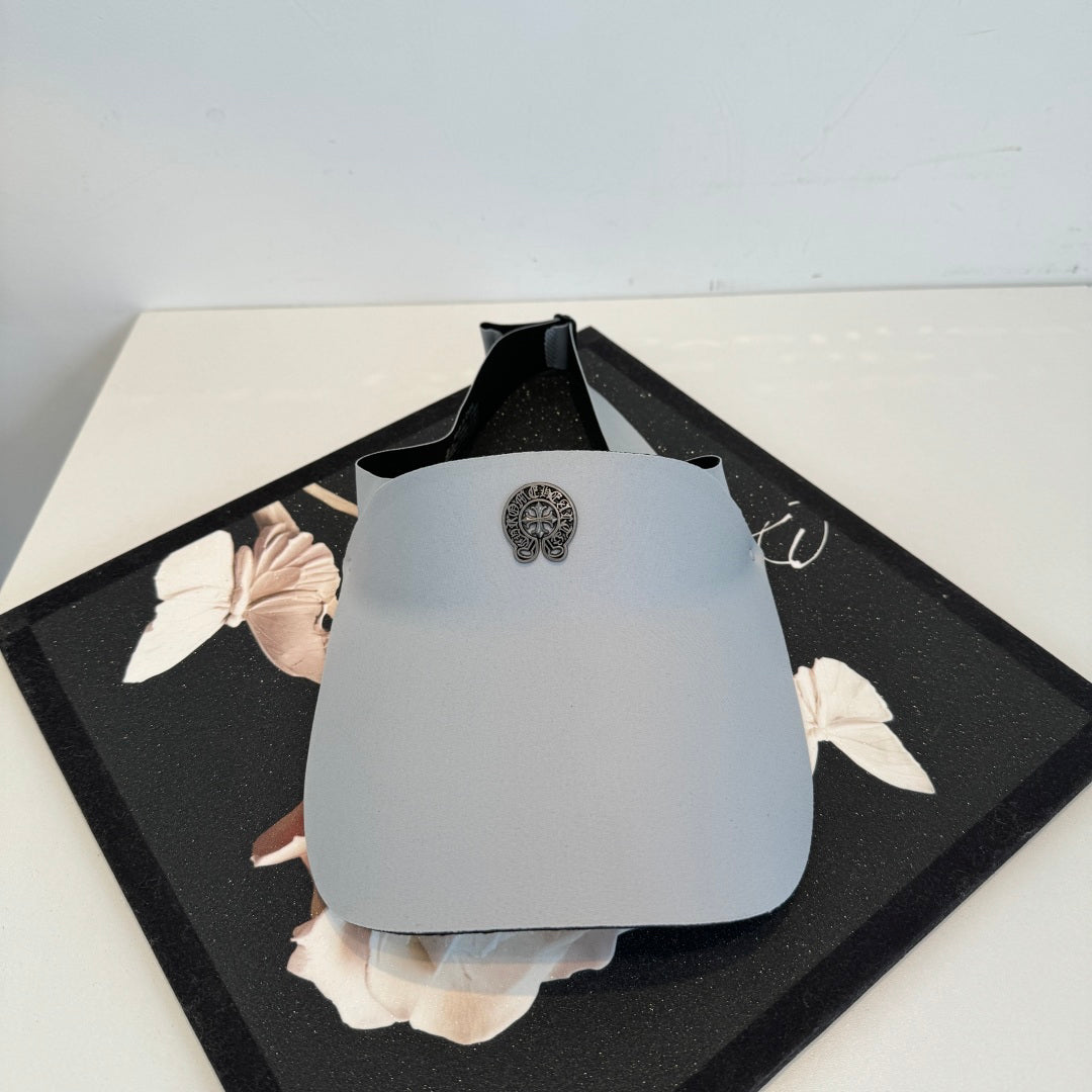 A Chrome Hearts open-top sun visor.