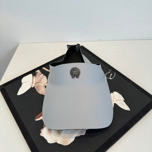 A Chrome Hearts open-top sun visor.