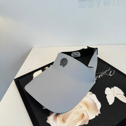 A Chrome Hearts open-top sun visor.