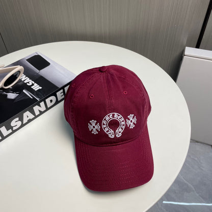 A burgundy baseball cap from Chrome Hearts.