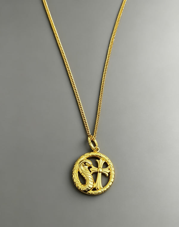 A snake-shaped cross necklace from Chrome Hearts.