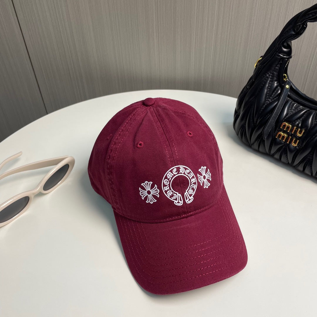 A burgundy baseball cap from Chrome Hearts.