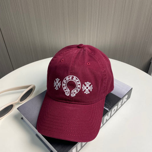 A burgundy baseball cap from Chrome Hearts.